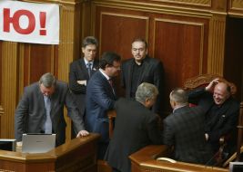People's deputies from "BYUT-Batkivshchina" block a tribune and presidium of parliament