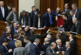 People's deputies from "BYUT-Batkivshchina" block a tribune and presidium of parliament