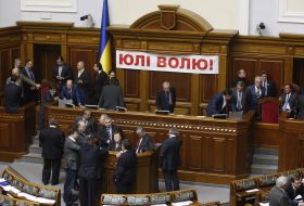 People's deputies from "BYUT-Batkivshchina" block a tribune and presidium of parliament