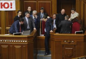 People's deputies from "BYUT-Batkivshchina" block a tribune and presidium of parliament