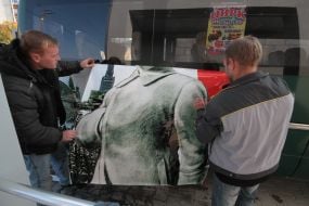 Placing of portrait of Stalin on the rout bus