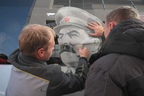 Portrait of Stalin on the rout bus