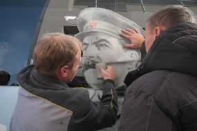 Portrait of Stalin on the rout bus