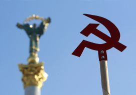 Hammer and Sickle on the background of the Monument of Independence