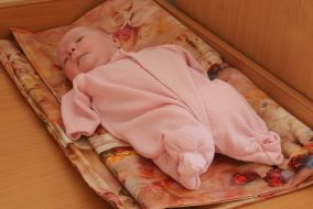 Infant in the House of Babies