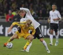 Roman Bezus and Toni Kroos
