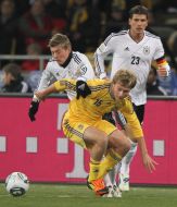 Roman Bezus and Toni Kroos