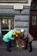 Ceremony of laying-on of flowers near at building, where Peter Stolyarskiy lived 