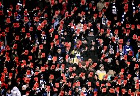 Supporters FC "Dynamo" (Kiev) show the red card