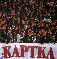 Supporters FC "Dynamo" (Kiev) show the red card