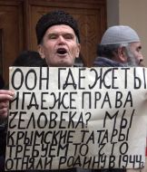 Participants of action of protest holds a placard