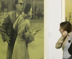 A visitor examines an exhibit exhibition