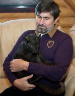 Igor Kalchenko holding a baby leopard