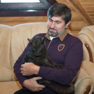 Igor Kalchenko holding a baby leopard