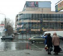 A placard depicts Adolf Hitler