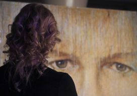 A visitor near the portrait of Aleksandr Shovkovsky