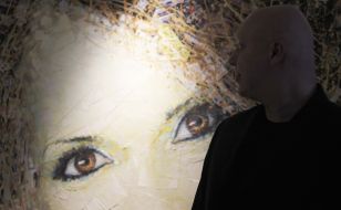 A man stands near the exhibit