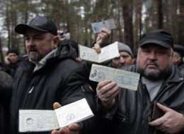Liquidators of Chernobyl disaster show their documents