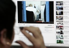 The girl looks from the video camera of Yuliya Timoshenko