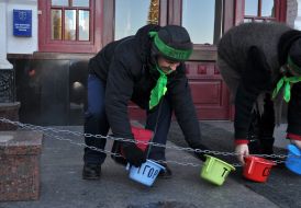 The habitants of tent small town carry chamber pots