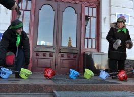 The habitants of tent small town carry chamber pots
