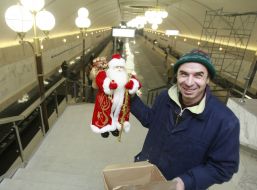 A worker holds the Grandfather Frost