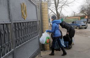 A woman carries the parcel