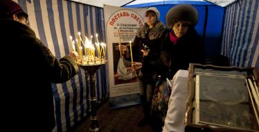 Parishioners put candles