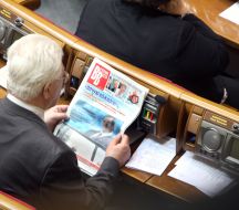 A people’s deputy reads a newspaper