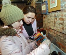 Visitors examines books