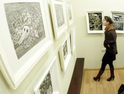 A girl examines picture