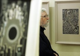 A man examines picture