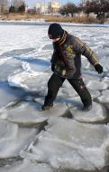 A boy tries to pass over ice
