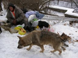 Homeles bask in a heat pipe