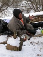 Homeles bask in a heat pipe