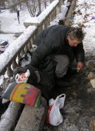 Homeles bask in a heat pipe