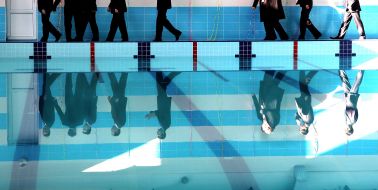 Reflection of pool opening participants 