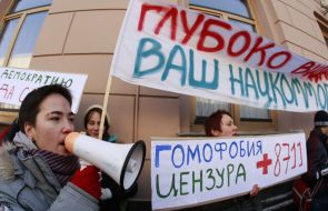 Protesters holds placard
