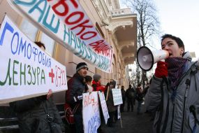 Protesters holds placard