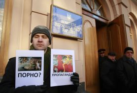 Protester holds placard