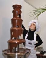 Confectioner creates a sculpture made of chocolate