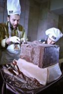 Confectioner creates a sculpture made ​​of chocolate