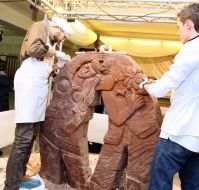 Confectioner creates a sculpture made ​​of chocolate
