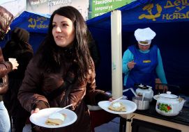 A girl holds pancake
