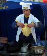A man prepares pancakes