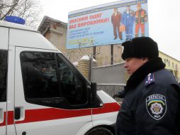 Employee of militia near the car of fast medical 