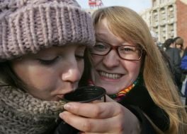 Participants of flesh mob  drink tea