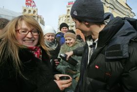 Participants of flesh mob  drink tea 