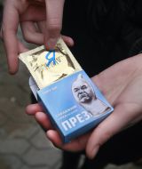 The participant of action holds a box with a contraceptive