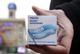 The participant of action holds a box with a contraceptive